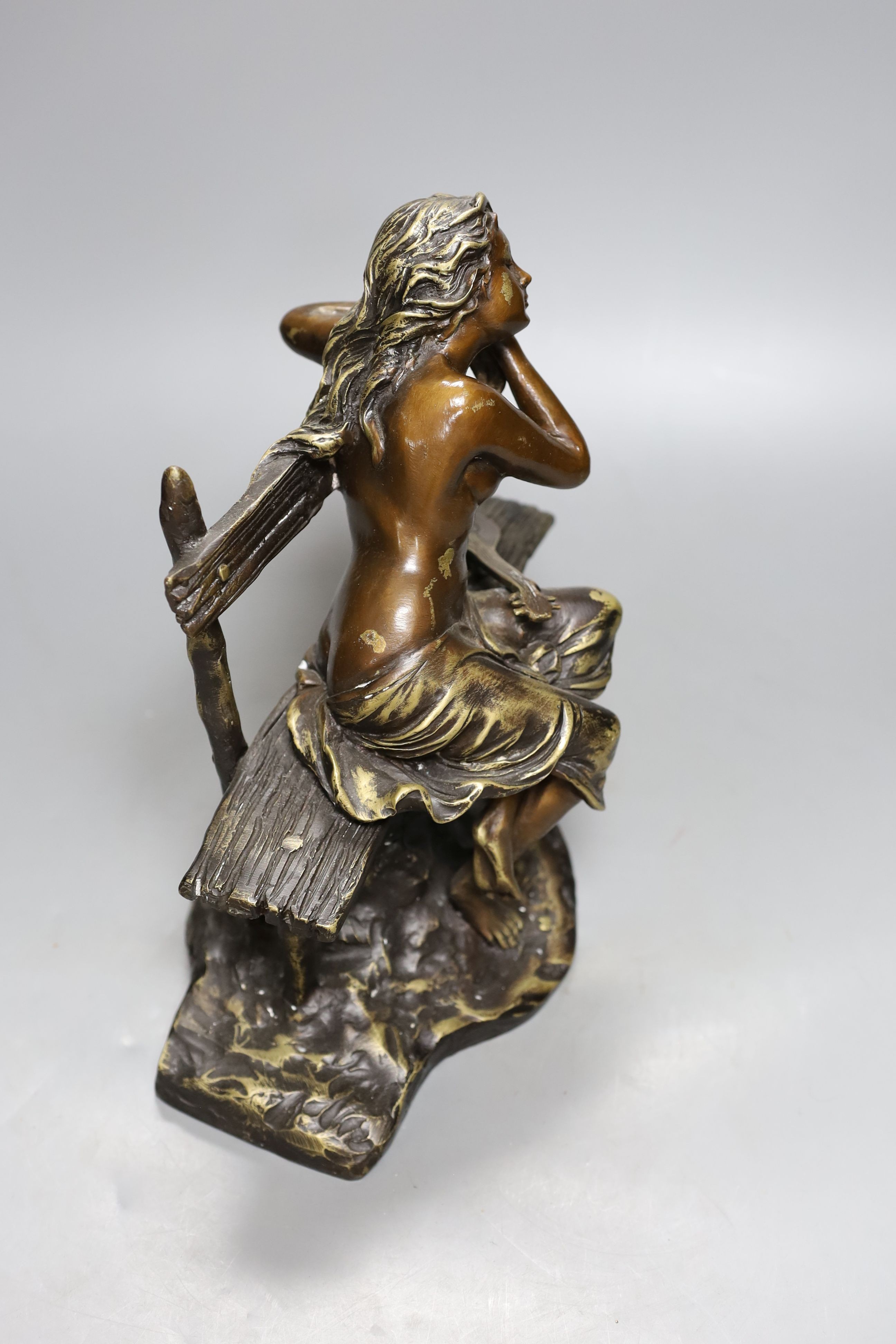 A bronze female, seated with lute, 27cm.